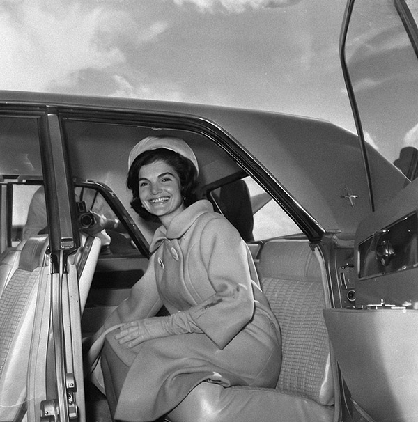 First lady, Jackie Kennedy in the back seat of a car