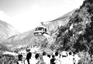 Villagers watch the medical helicopter leave for Kathmandu.