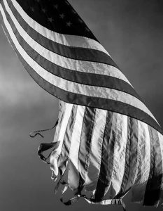 photo of a frayed U.S. Flag