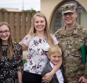 Dustin Whitcomb with his wife and two children.