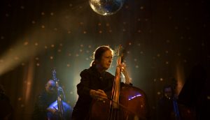 Orin O’Brien on stage, playing a double bass.