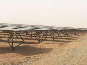 A solar panel farm in the desert.