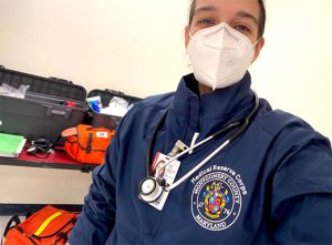 Ava Movahed Abtahi wearing a mask and a shirt that says "Medical Reserve Corps, Montgomery County Maryland"